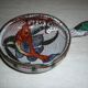 Frying pan with fat lava and ceramic fish decor