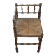 Antique corner chair in wood bamboo style seated in straw
