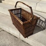 Brown wicker/rattan basket-shaped magazine rack