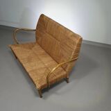 Vintage French papercord sofa with a metal frame base