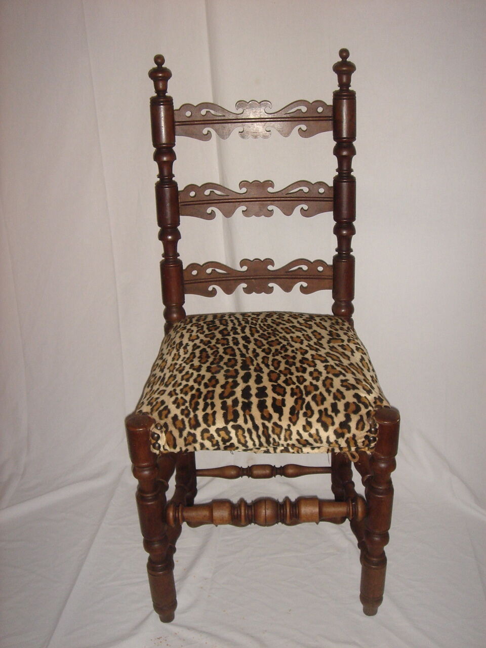 Old chair covered Leopard fabrics