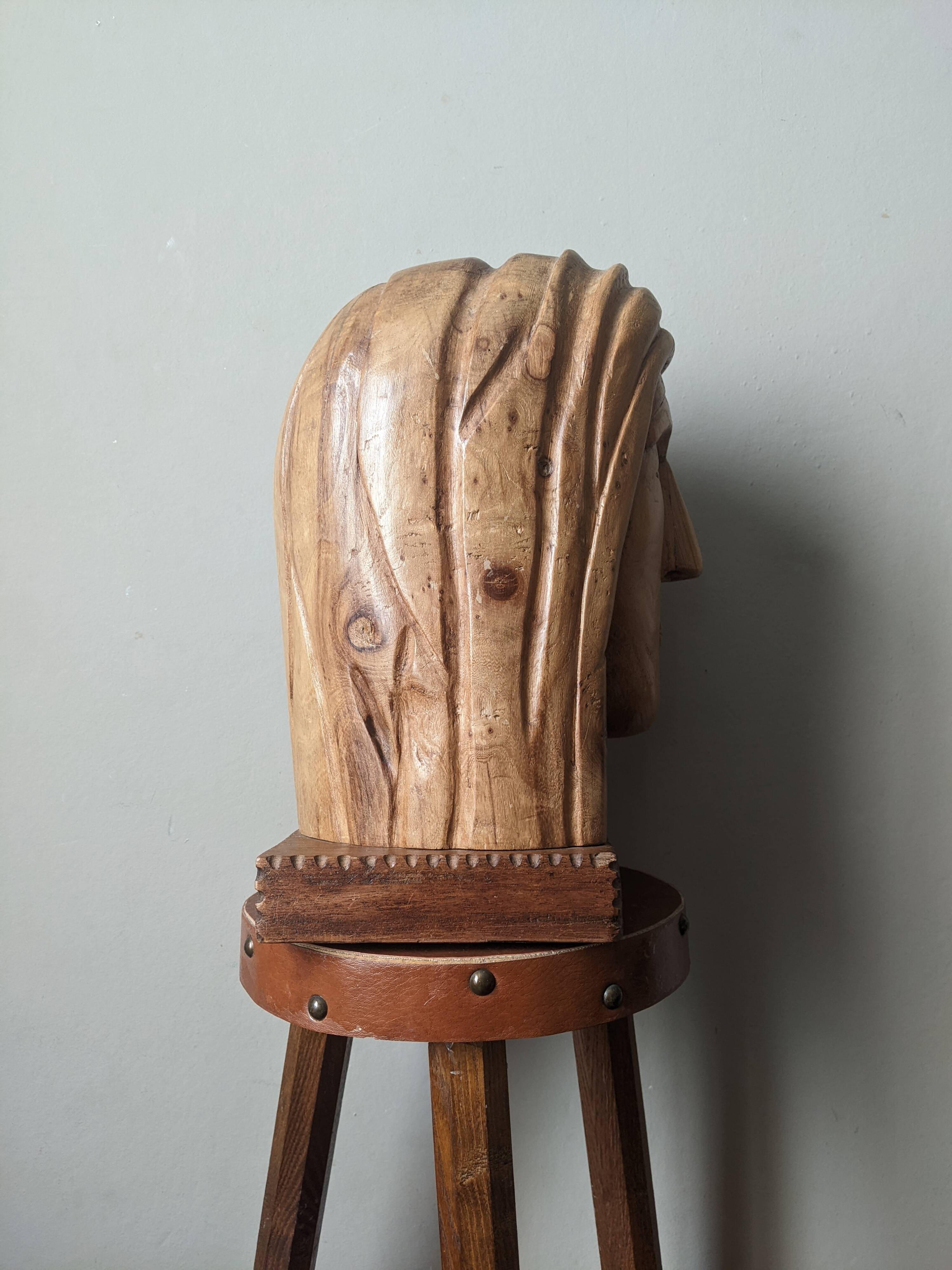 Handcrafted sculpture of the head of Christ in elm.