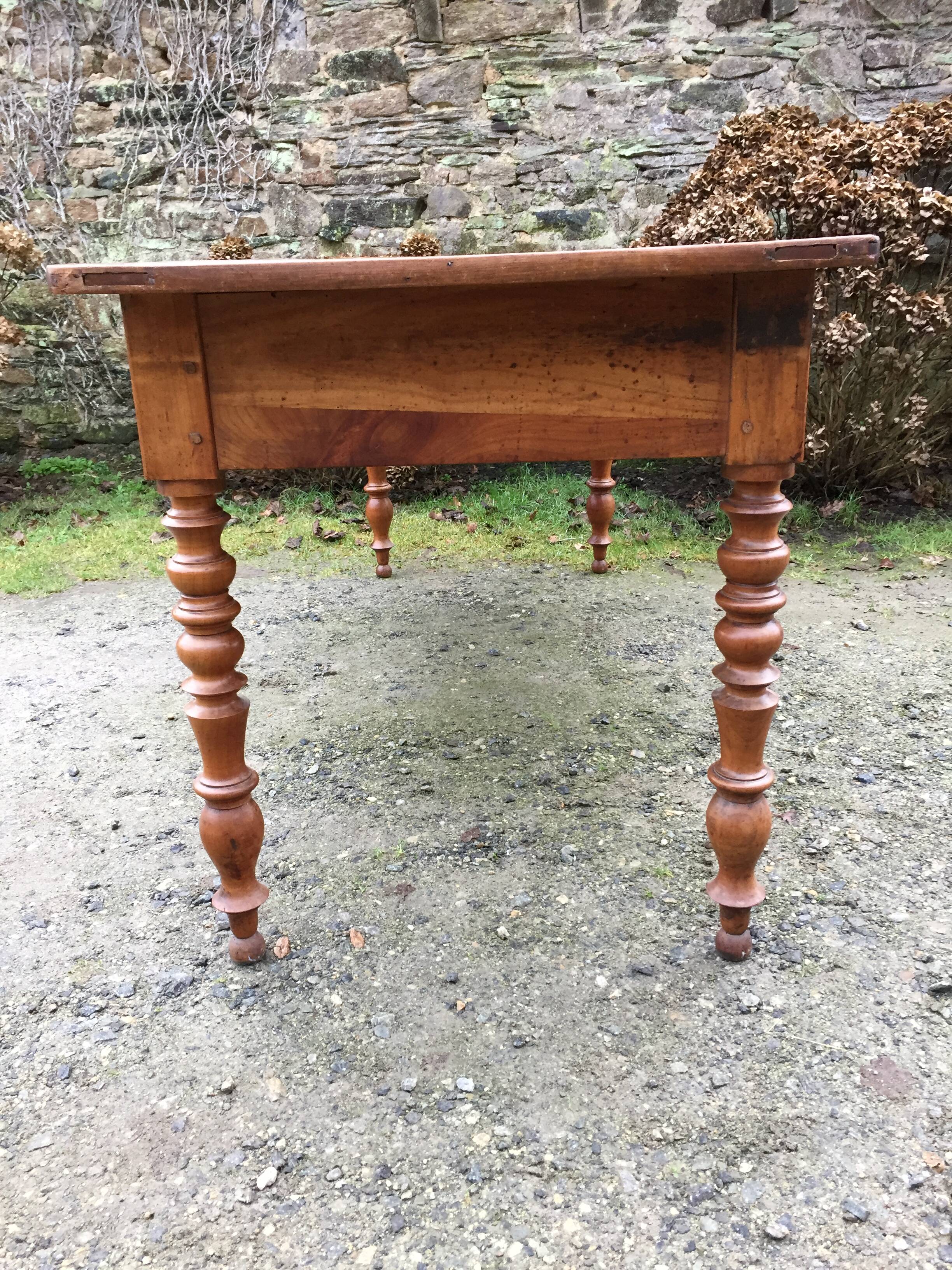 Old cherry farmhouse table with 3 drawers and turned legs