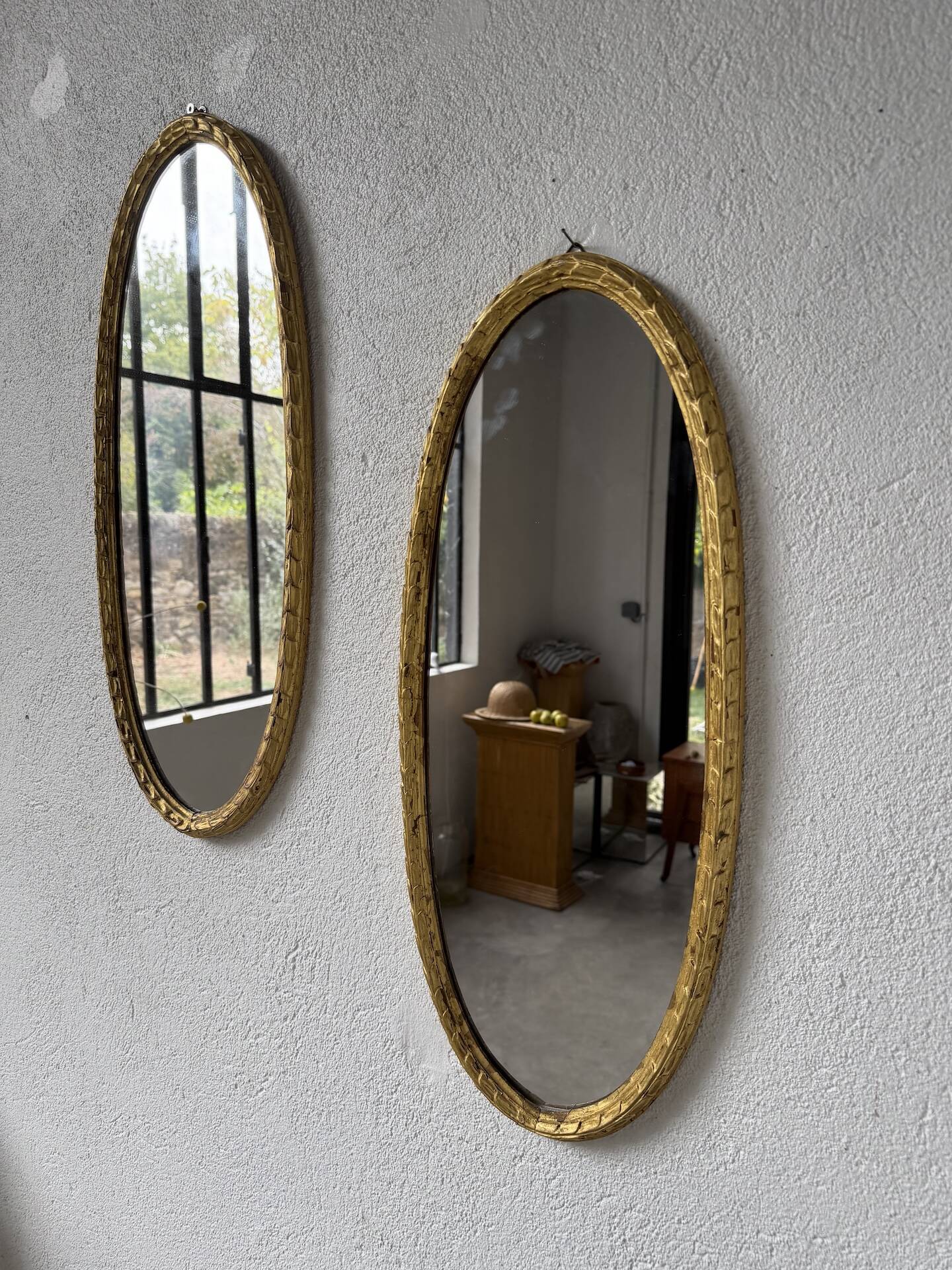 Pair of oval mirrors 1900 gilded stucco