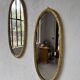 Pair of oval mirrors 1900 gilded stucco