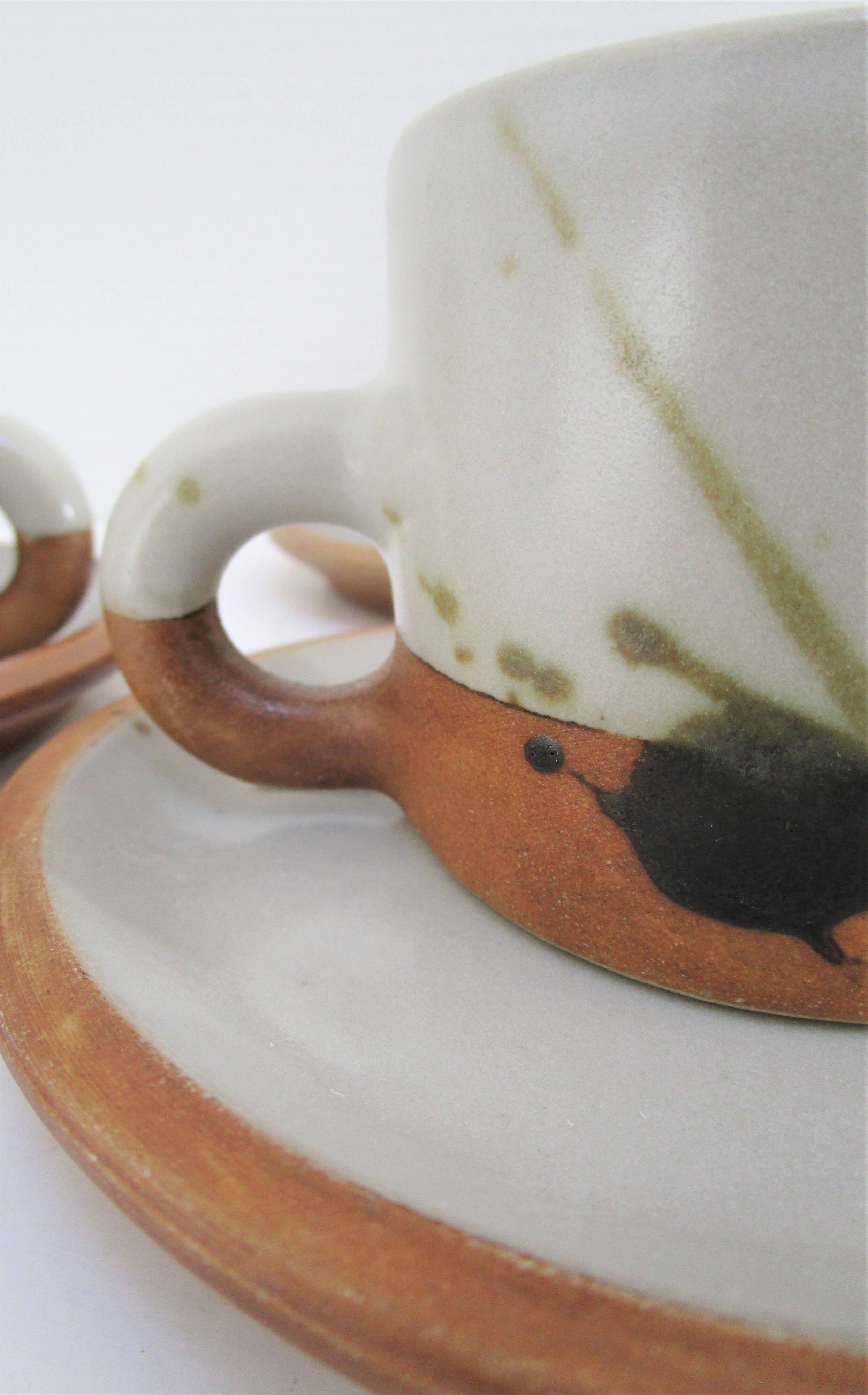 Four pottery cups and saucers from La Colombe Vallauris