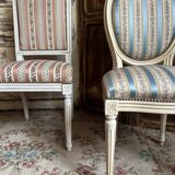 Pair of Louis XVI style chairs in painted wood and satin, classic elegance.