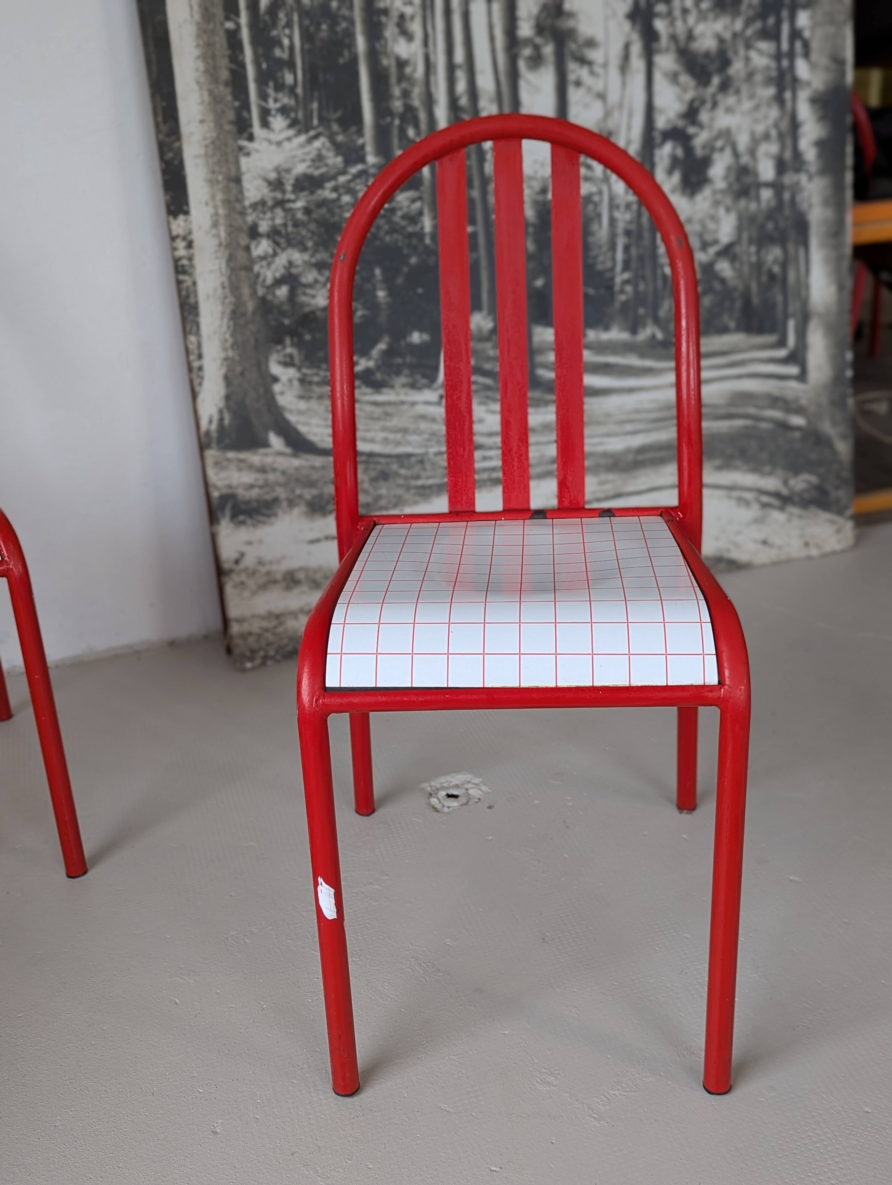 Set of 4 modernist red metal chairs