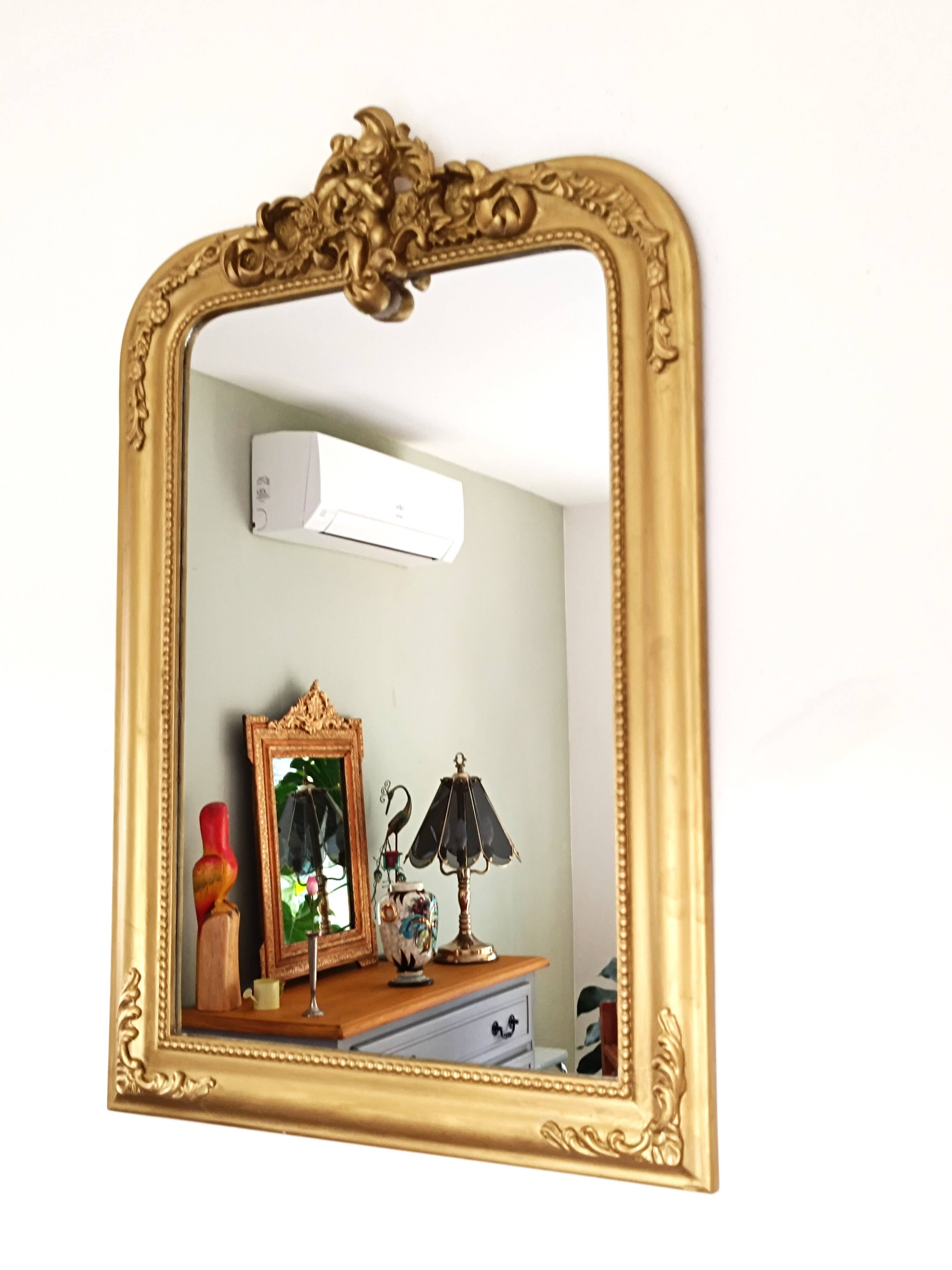 Gilded mirror with a Louis Philippe style pediment