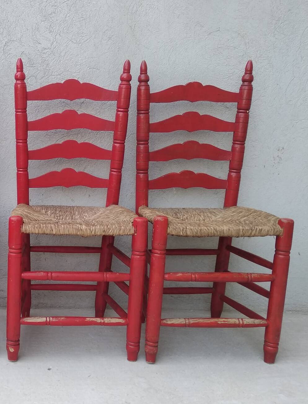 2 vintage red straw chairs