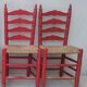 2 vintage red straw chairs