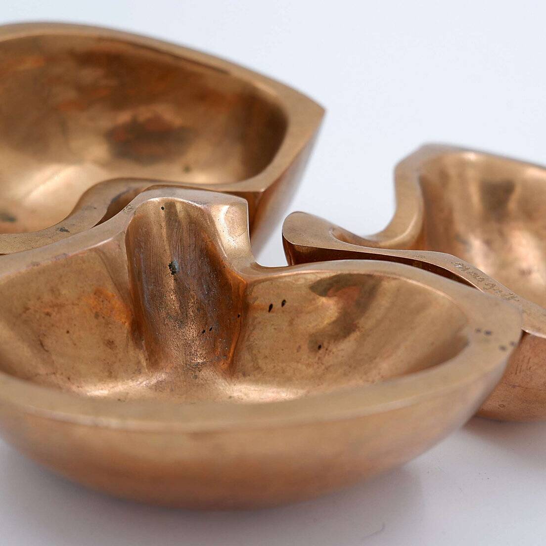 Empty Pockets in polished bronze Margrit van Nuffel 1970, set of 3