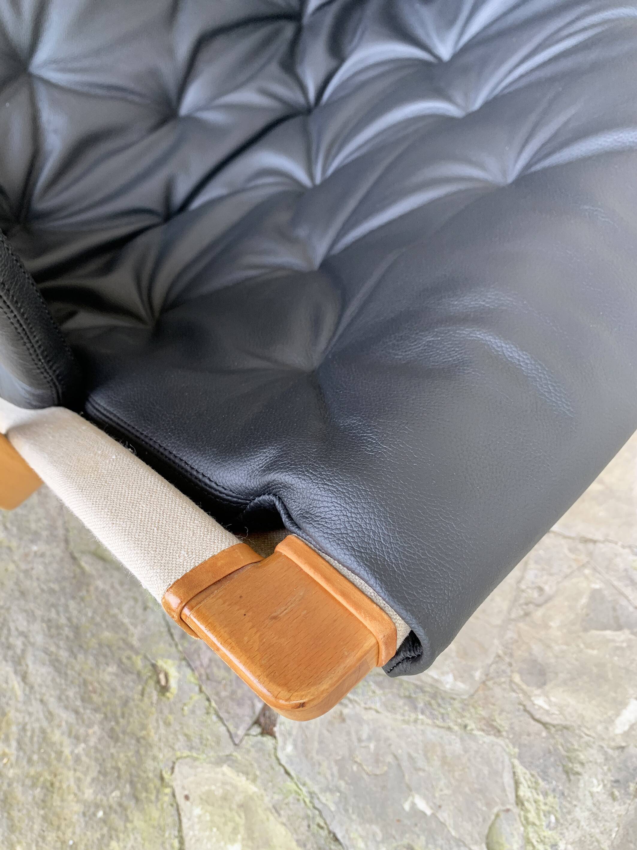 Pernilla armchair new black leather by Bruno Mathsson, Dux, Sweden 1970