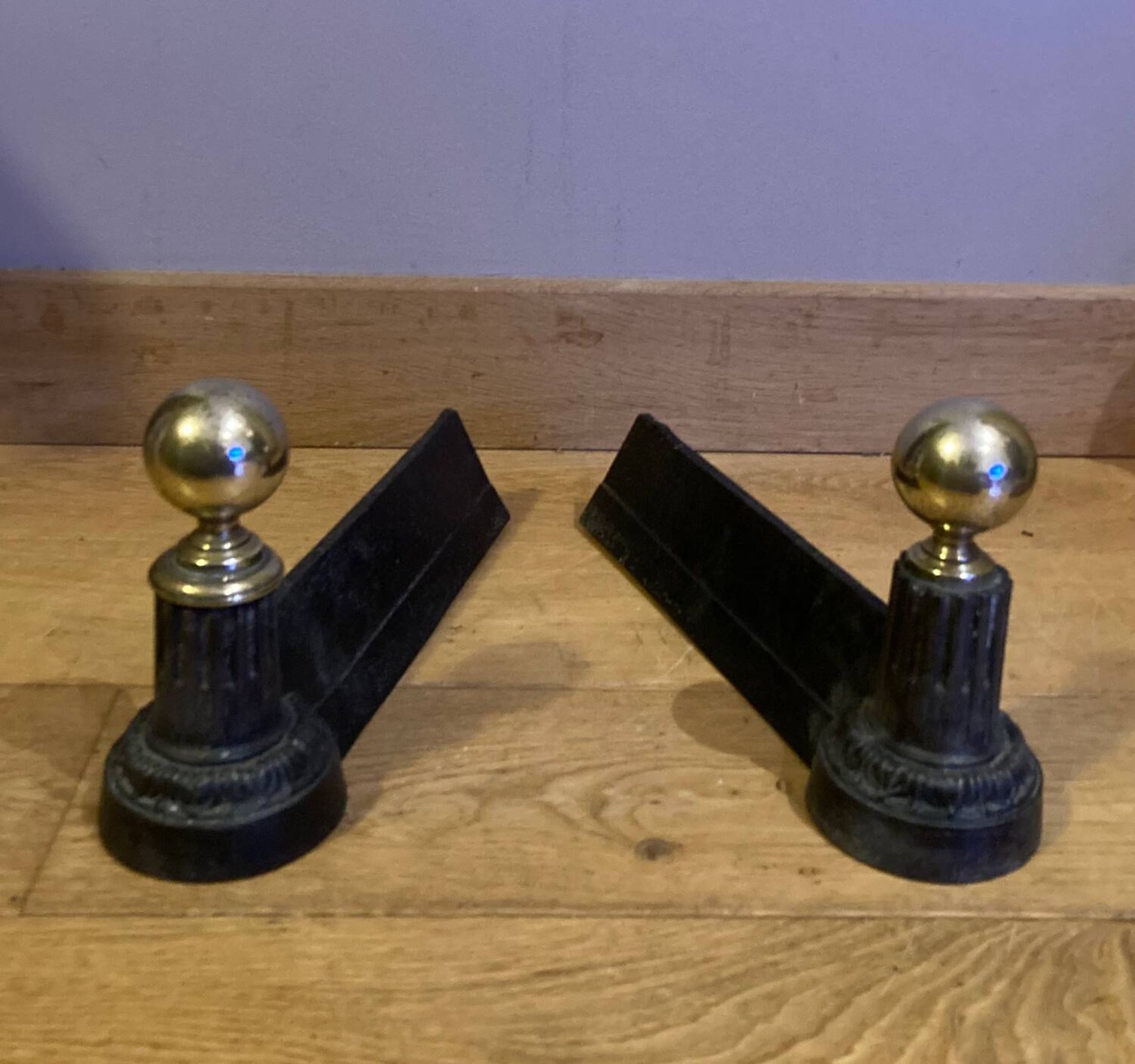 Pair of Napoleon III andirons from the 19th century in cast iron and brass