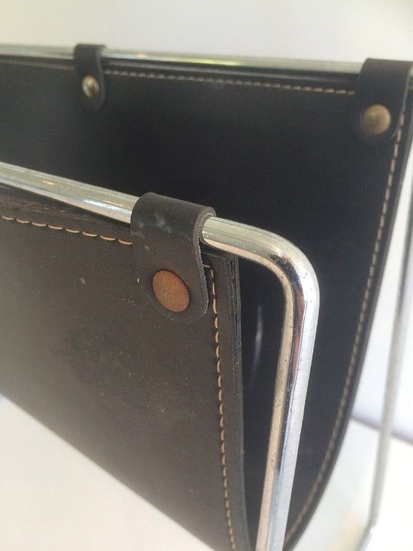 Chrome and black leather magazine rack