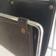 Chrome and black leather magazine rack