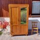 Vintage wardrobe with mirror and tapered legs.