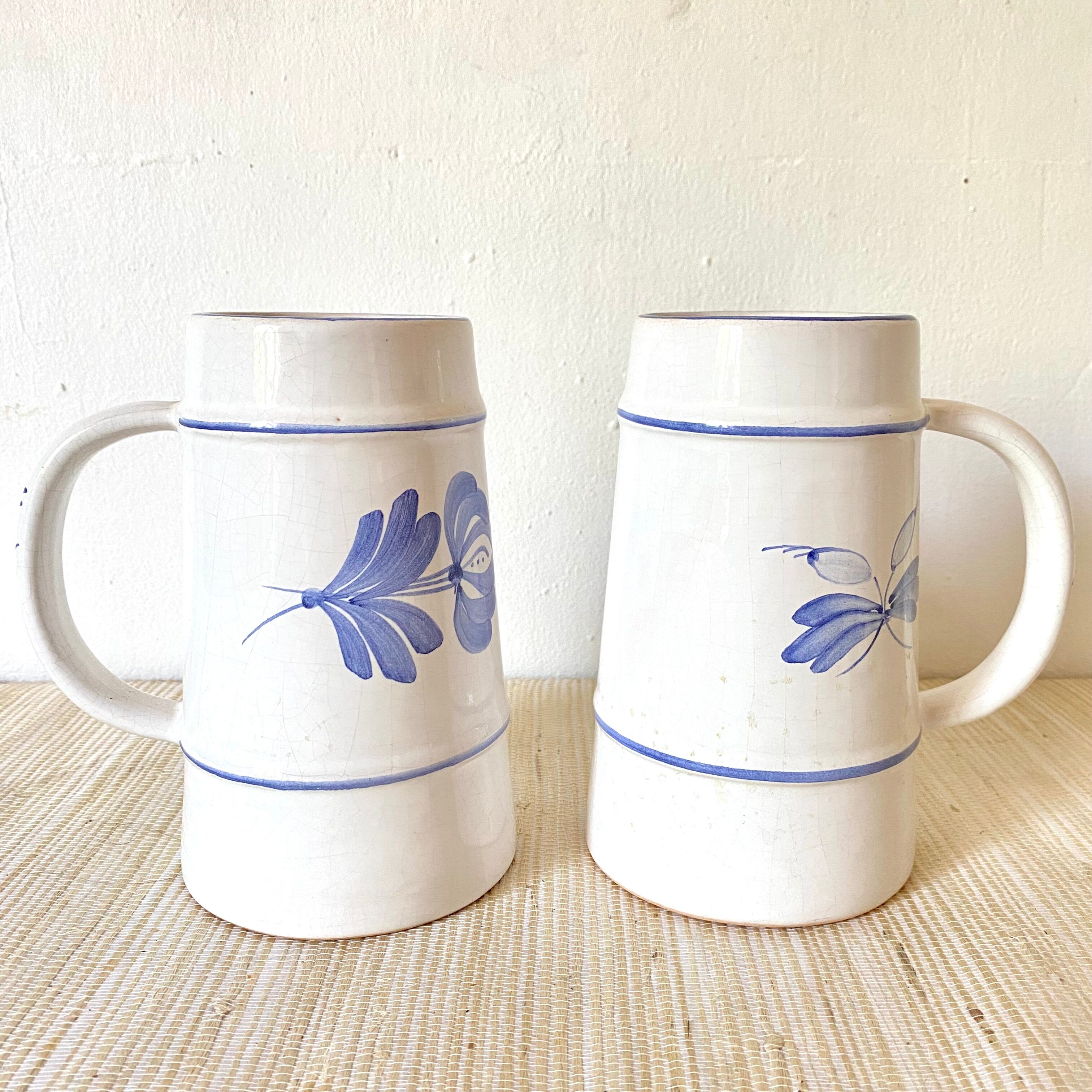 Flowery earthenware beer mugs