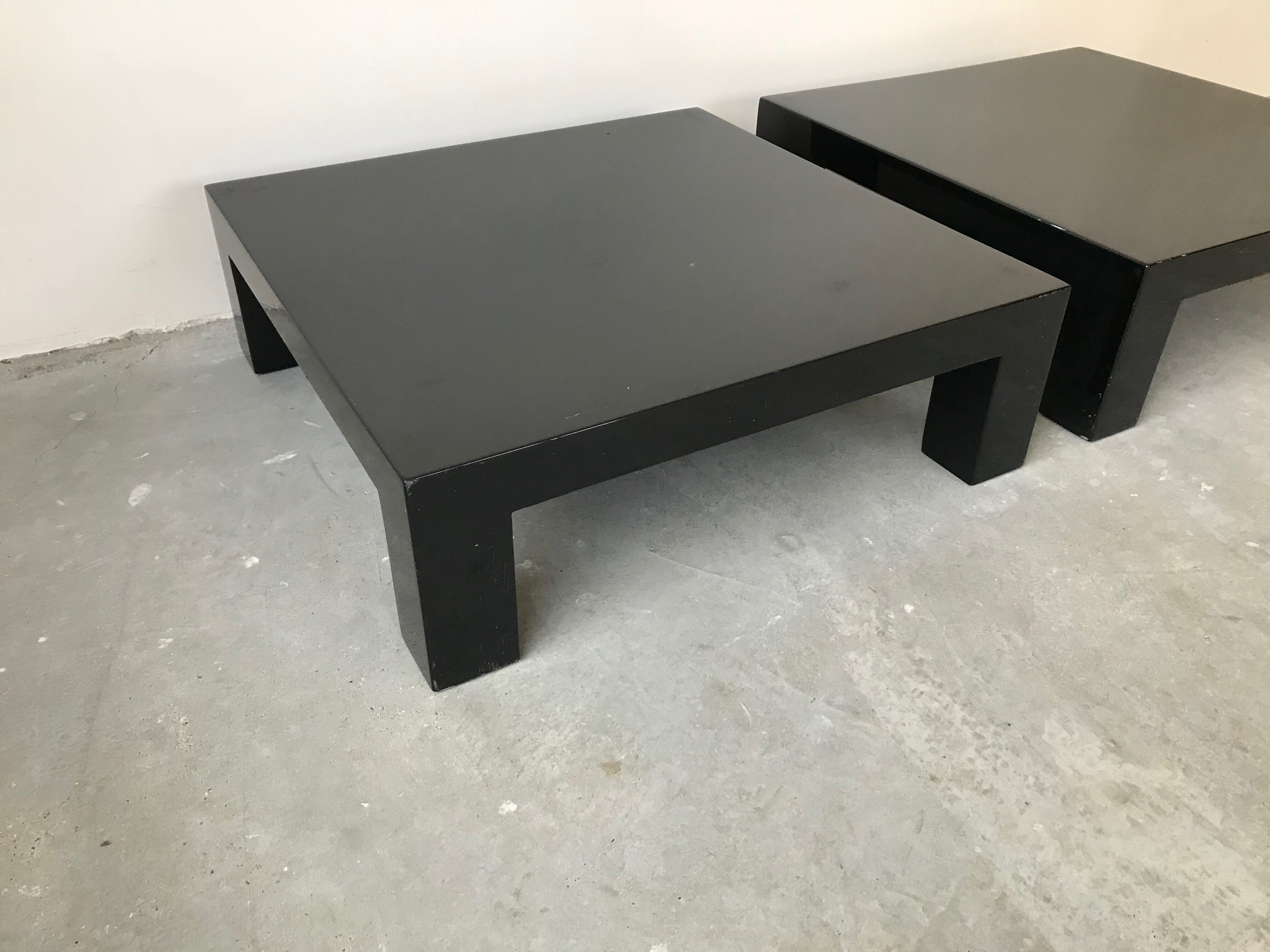 Pair of black laqué wood coffee tables, circa 1970.