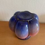 Blown glass vase with metal cage