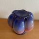 Blown glass vase with metal cage
