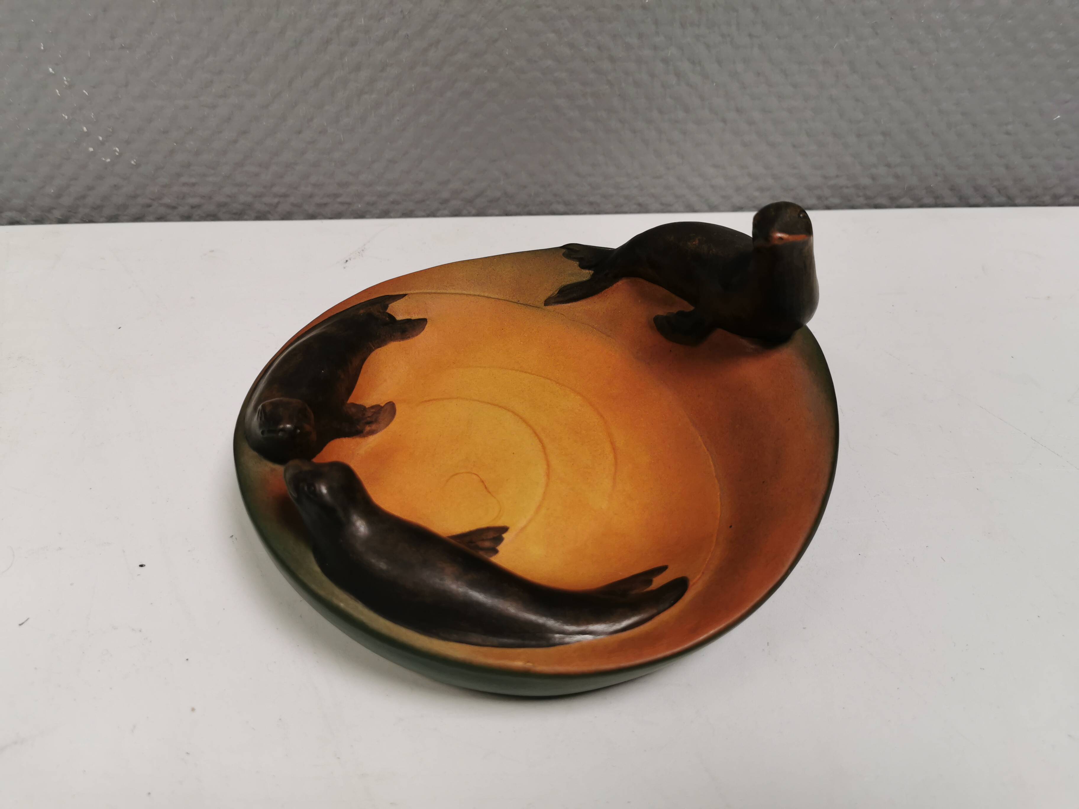 Dish with sea lions hand painted by Ipsen's widow, Denmark 1930s.