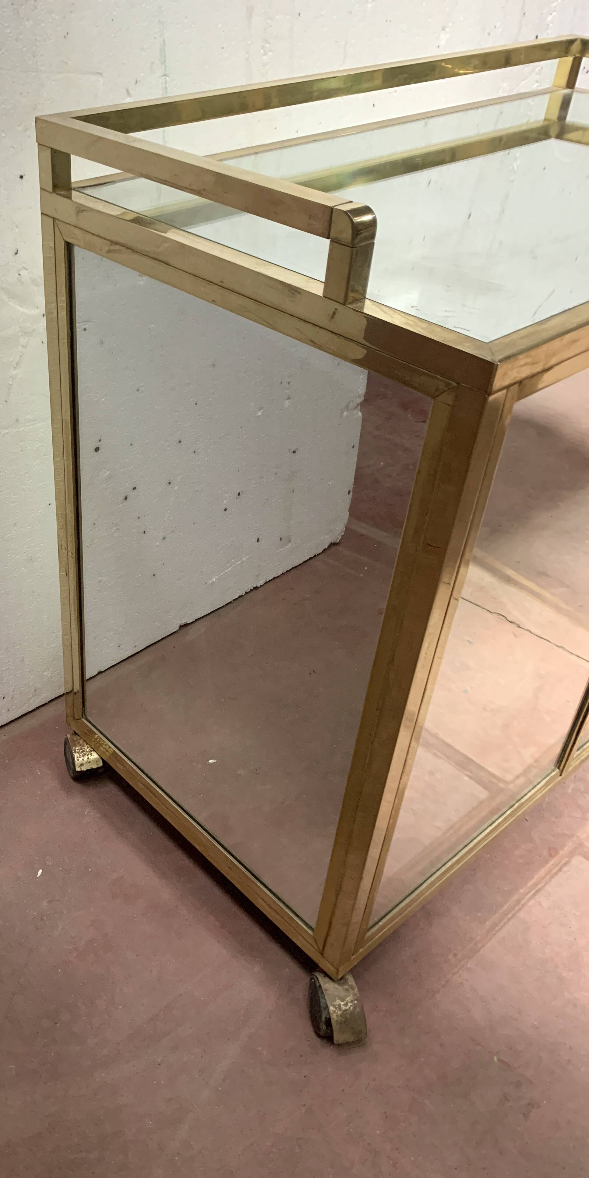 1970s brass bar with a mirrored front from the 20th century.