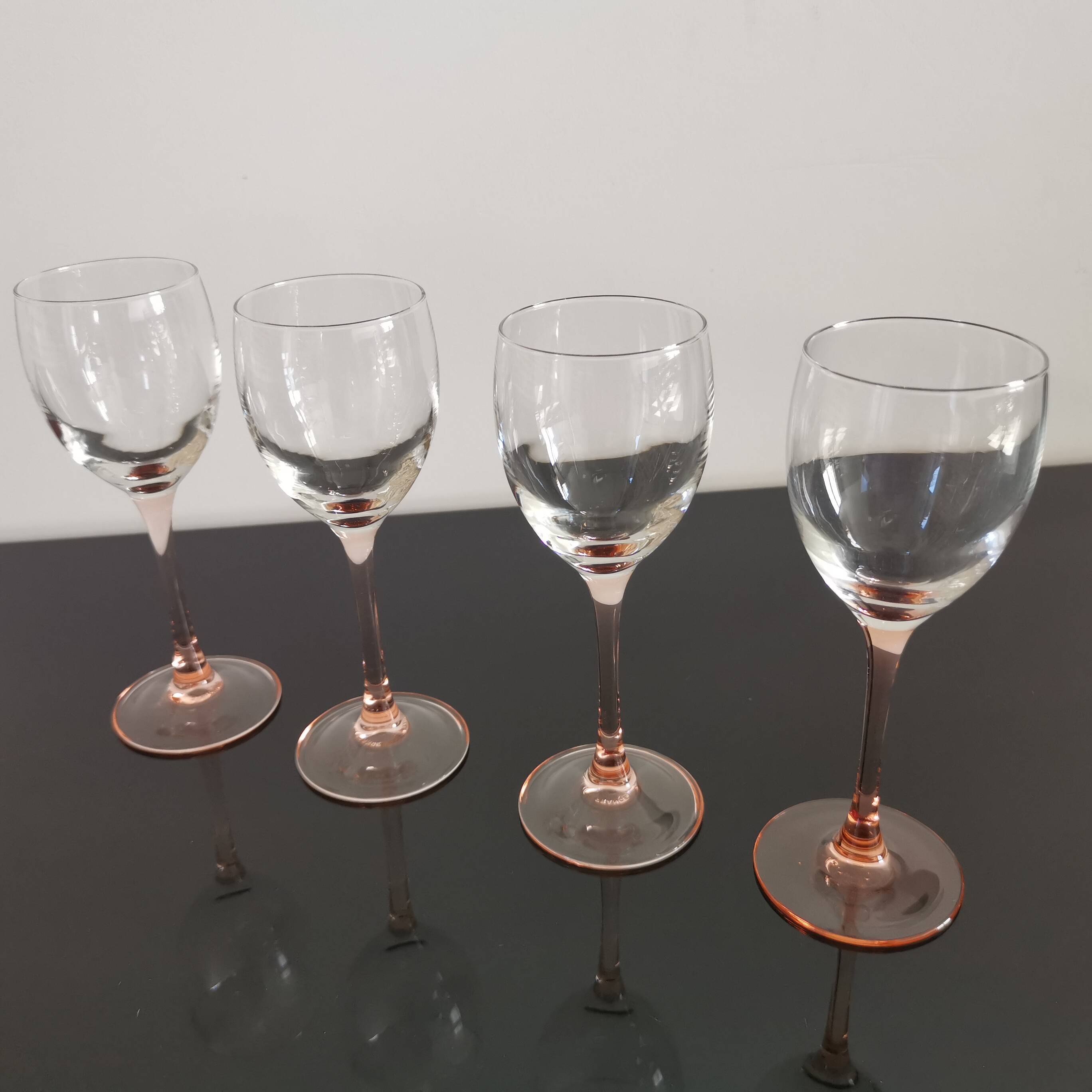4 Luminarc white wine glasses with pink feet
