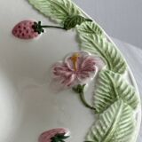 Ceramic slip dish with strawberry and flower pattern.