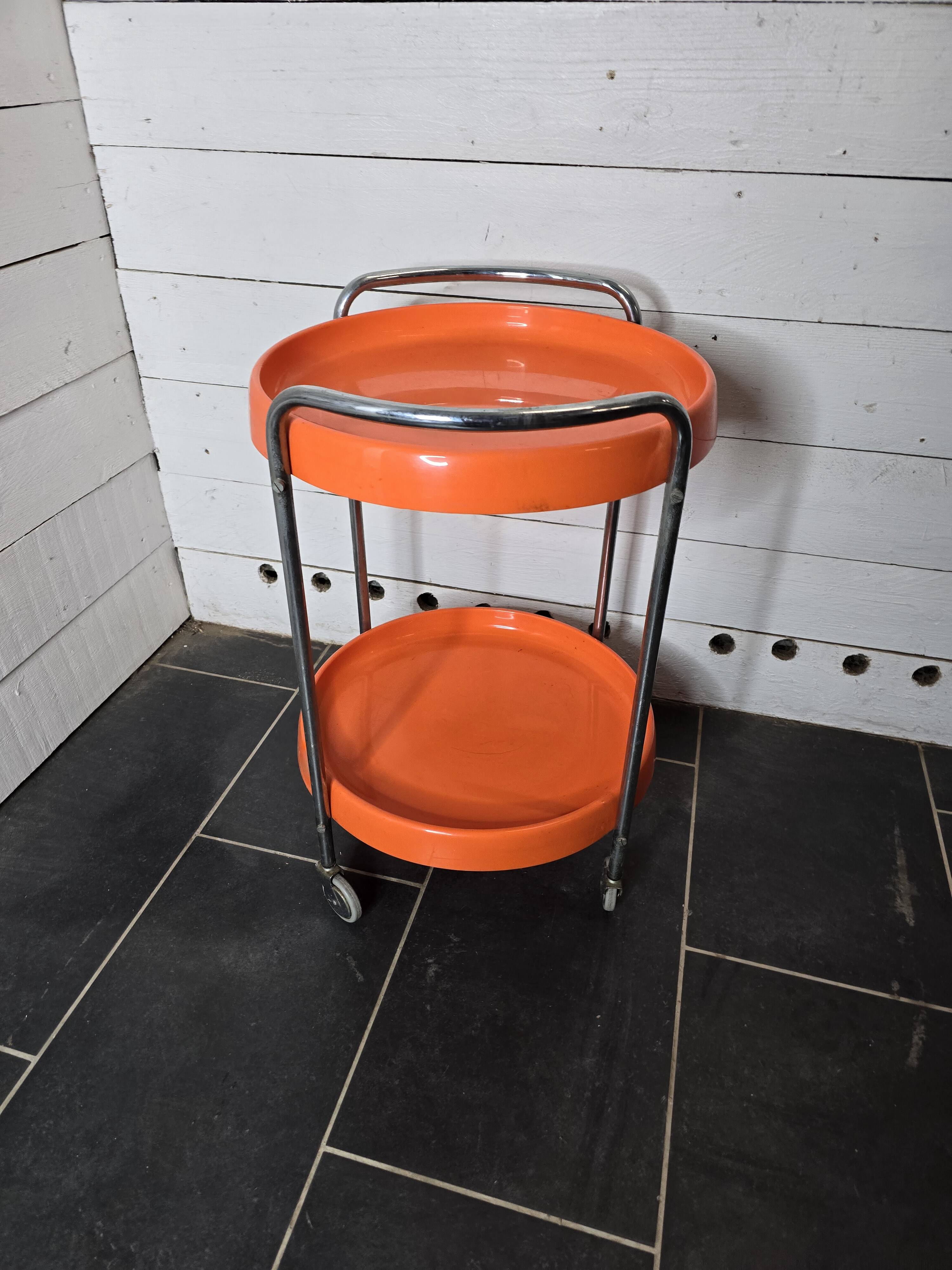 Orange trolley on wheels from the 70s