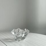 Empty pocket ashtray in transparent crystal organic shape.