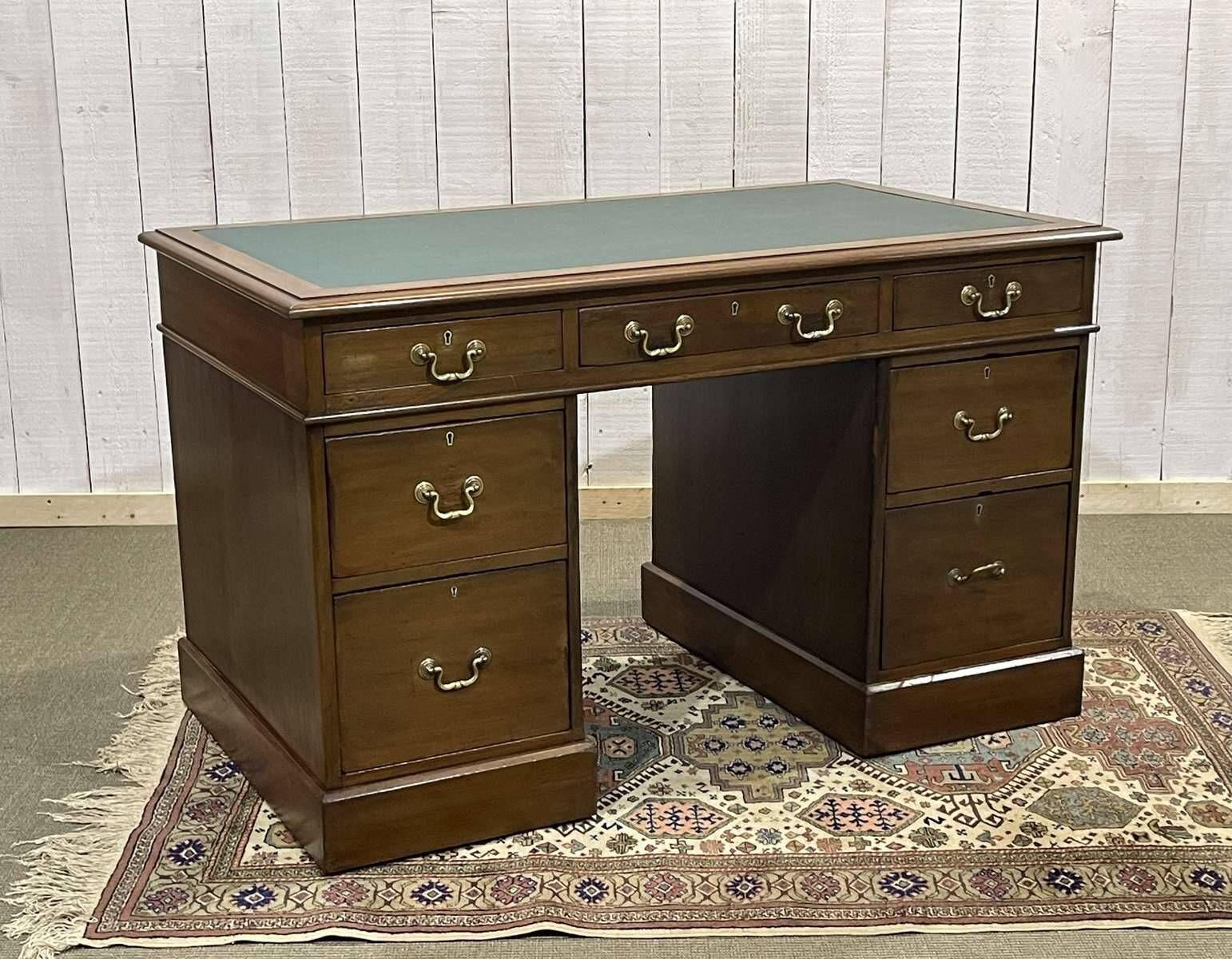 Late 19th century English mahogany desk with pedestals and leather top