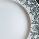 Old mismatched flat plates made of ironstone earthenware.