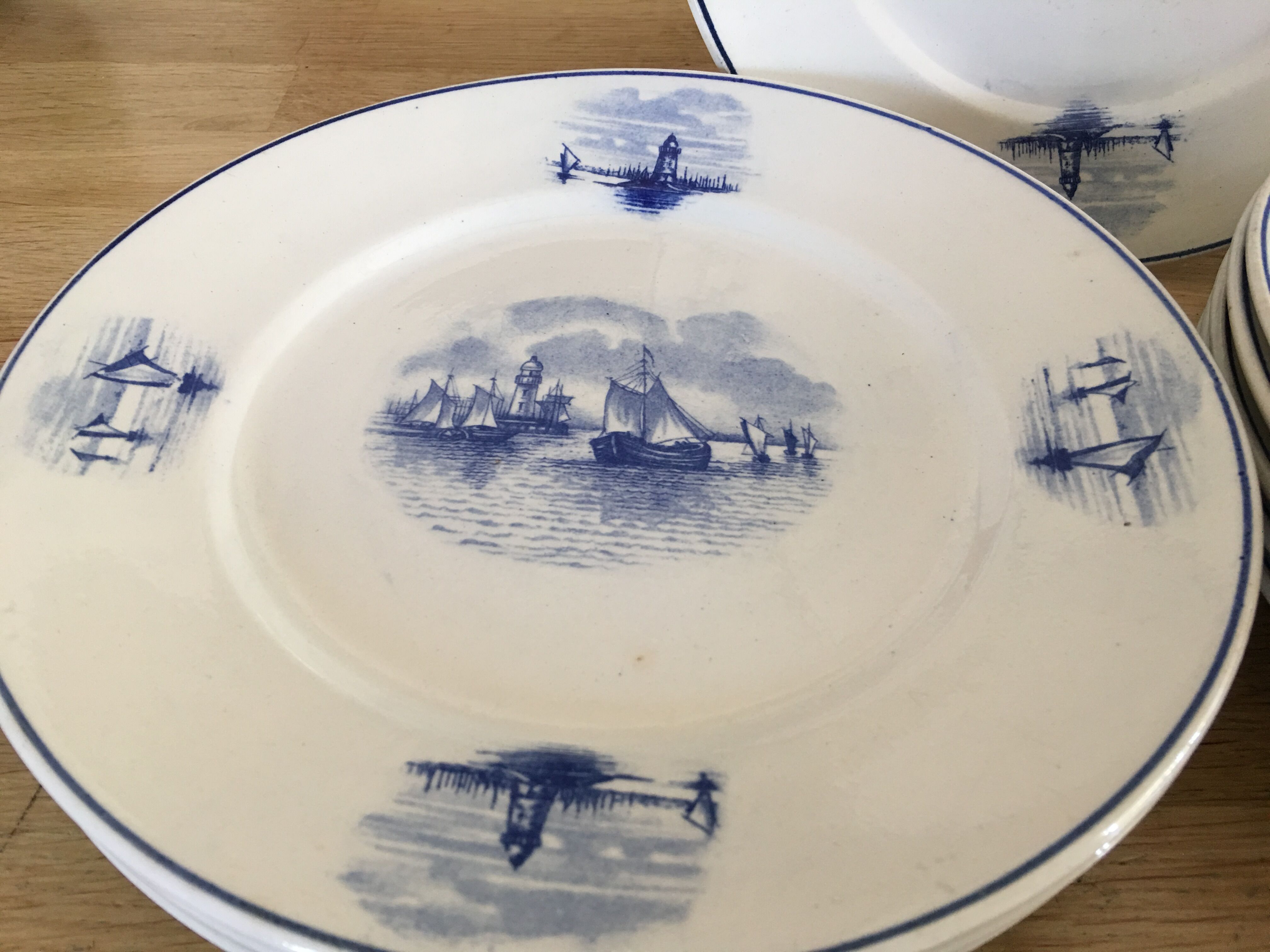 Series of 11 flat plates, Dutch earthenware, early XX