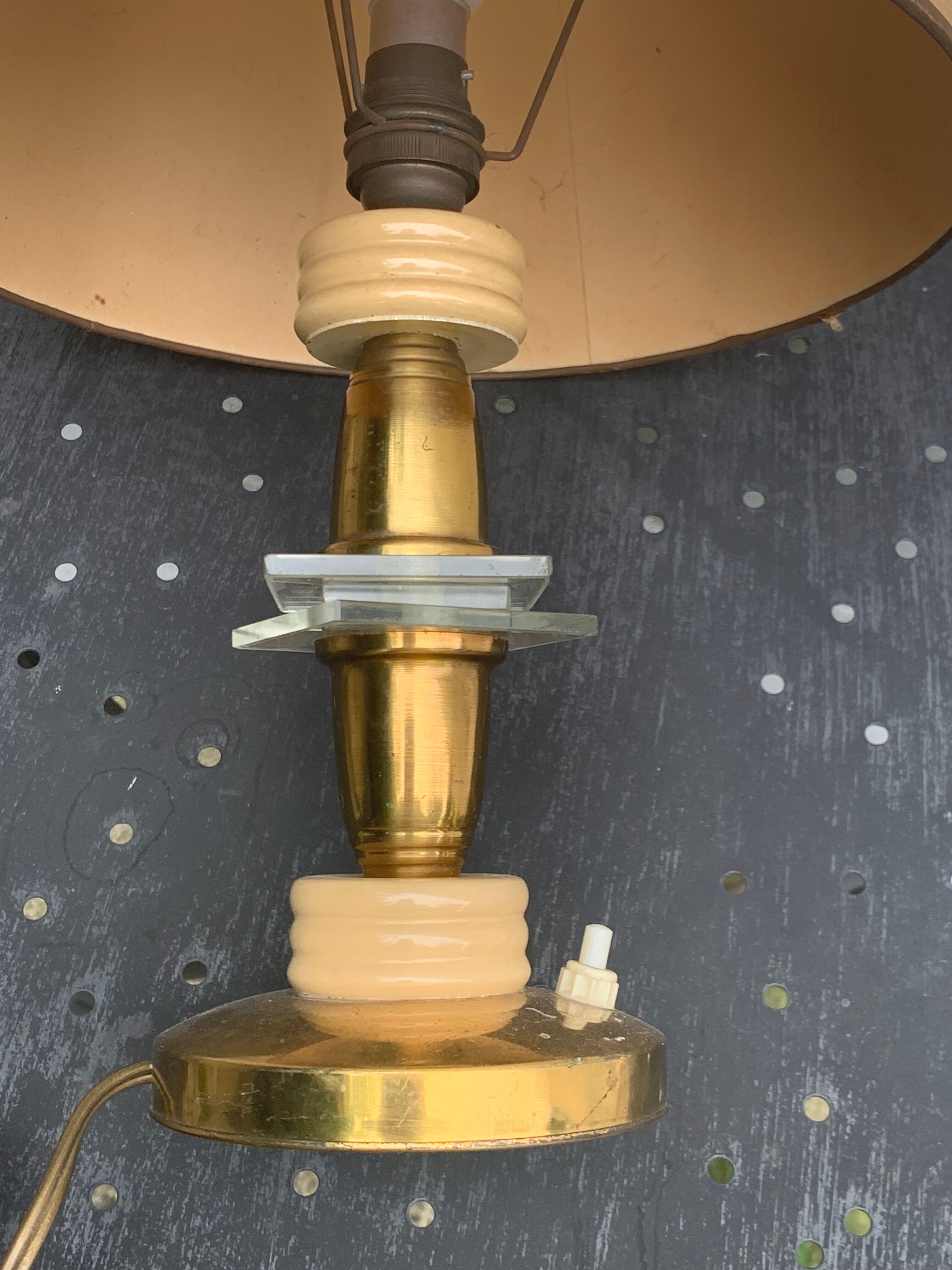 Table lamp in gilded metal, bakelite and antique plexiglass