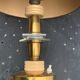 Table lamp in gilded metal, bakelite and antique plexiglass