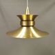 Large hanging lamp, made of brass-coloured aluminium with red and white contrast lacquer inside.