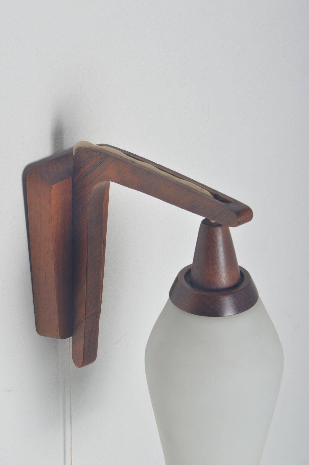 Danish wall lamp in teak with milk glass, 1960s