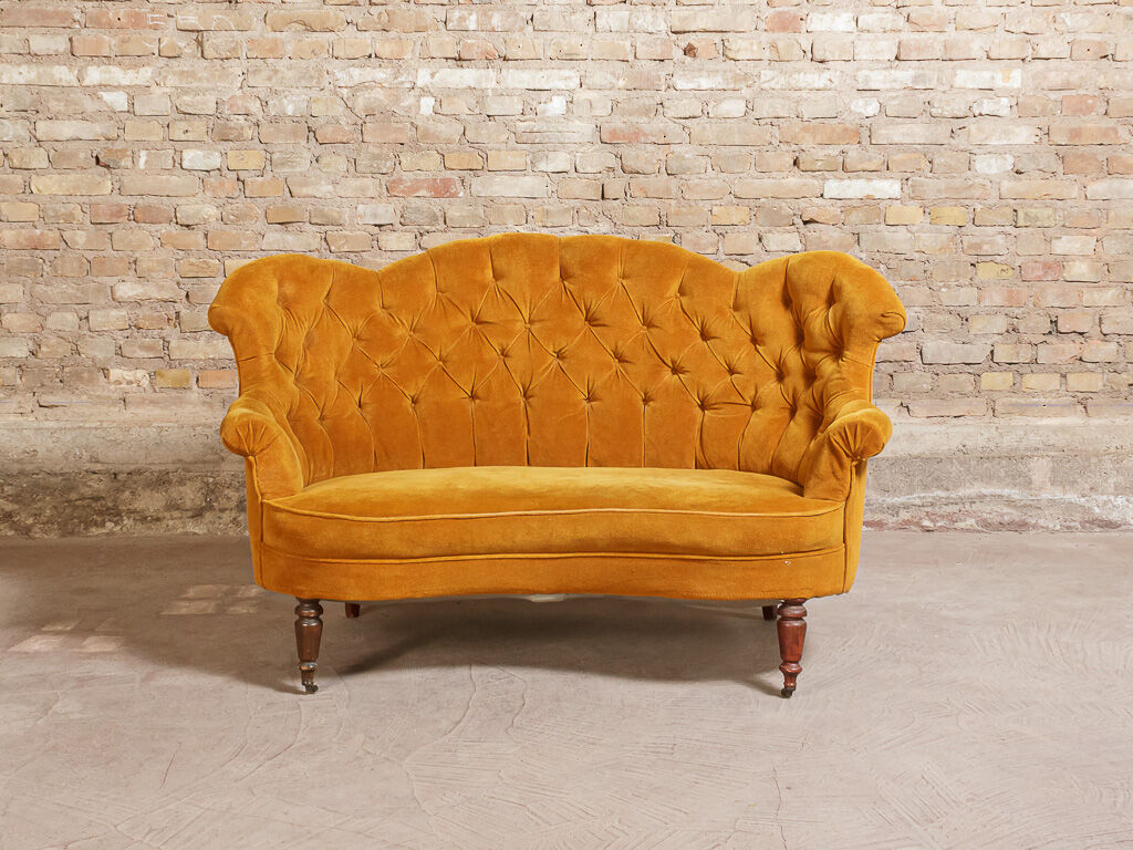 Yellow velvet padded toad sofa and wooden feet