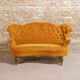 Yellow velvet padded toad sofa and wooden feet