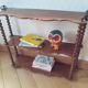 Turned wooden wall shelf
