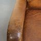 Charming and comfortable vintage armchair in grained cowhide leather with character