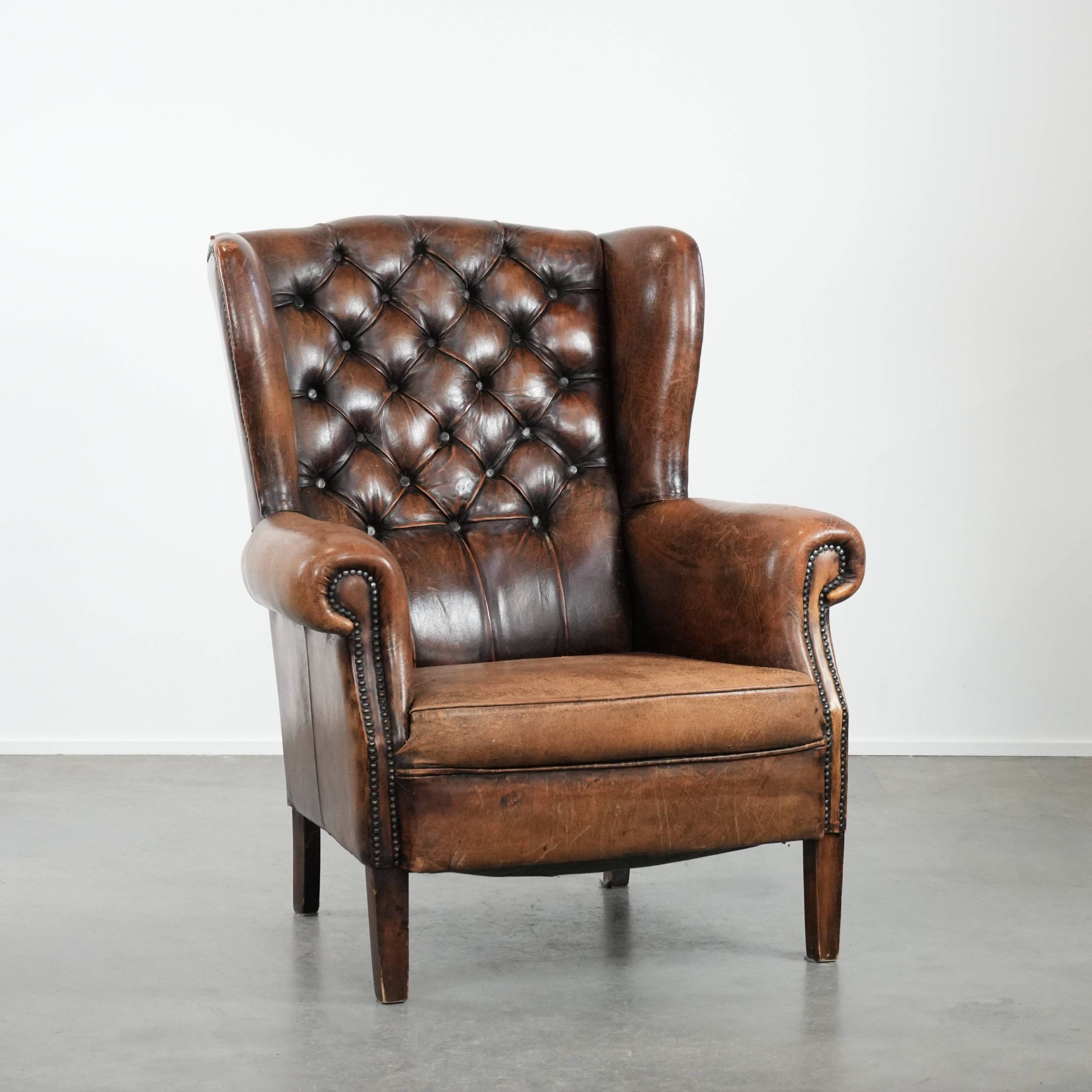 Unique large sheepskin Chesterfield wingback armchair in English style