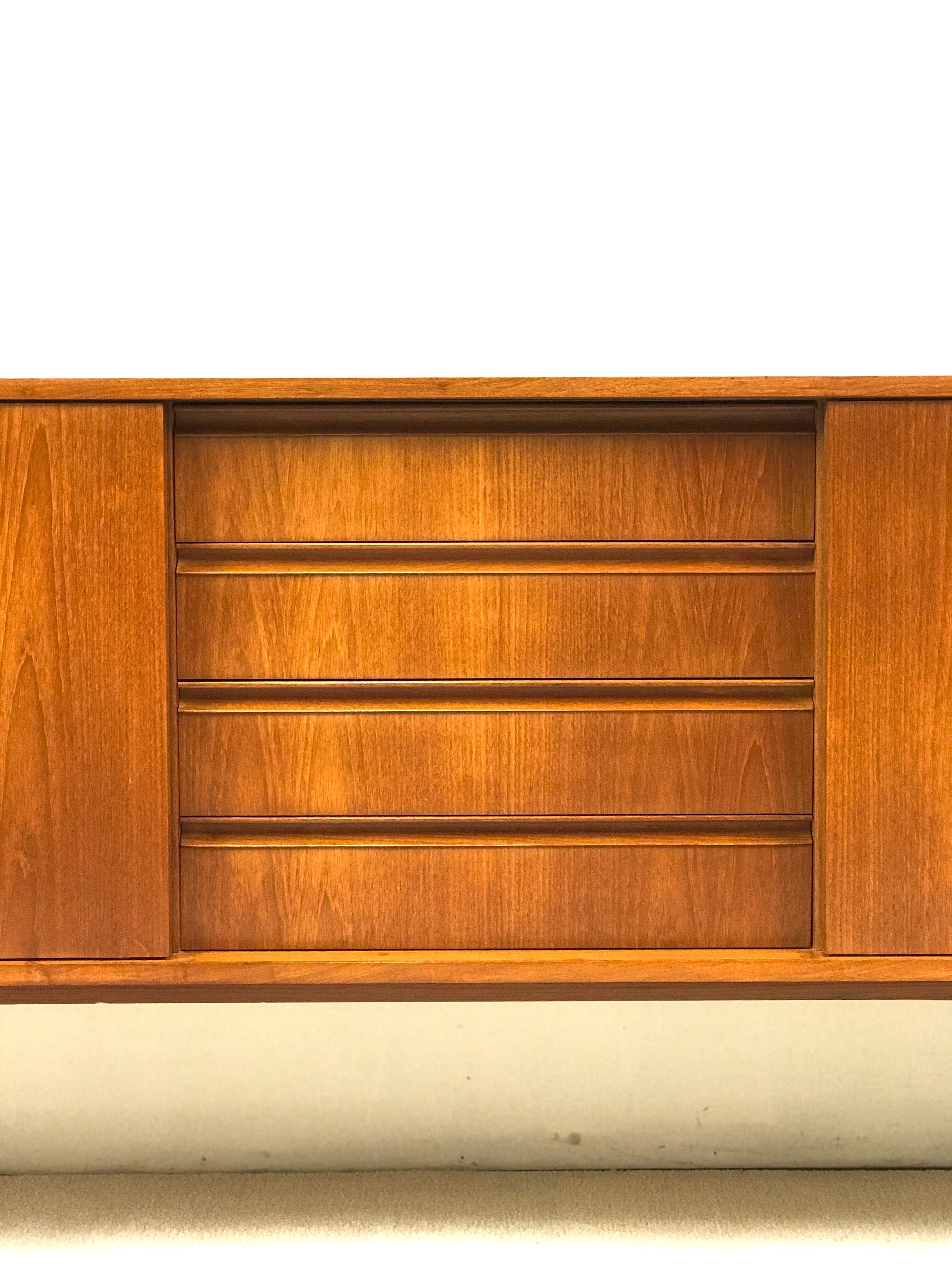 Danish teak sideboard with two sliding doors and 4 central drawers
