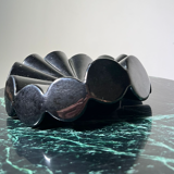 Empty pocket black glazed ceramic ashtray, 1970