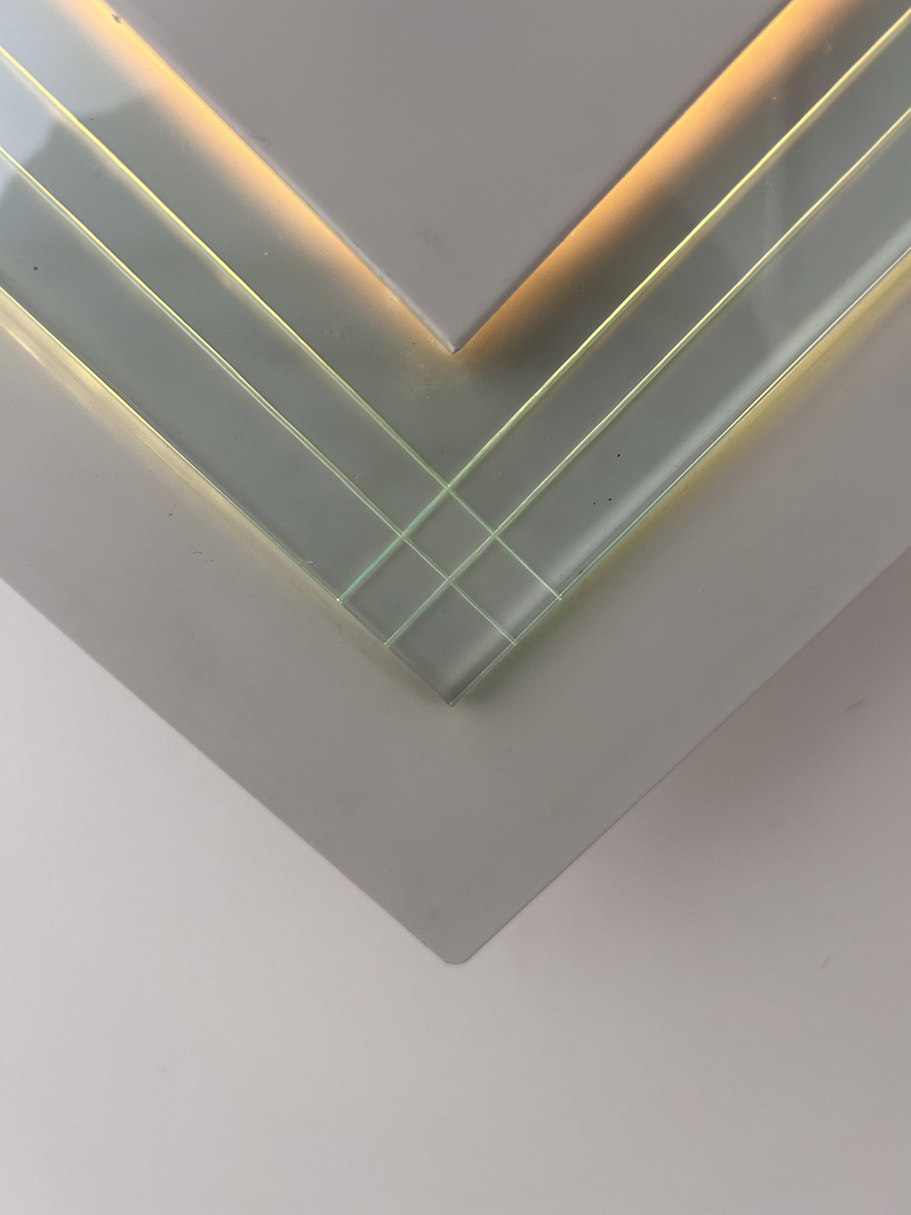 Pair of vintage wall lights, white lacquered metal and glass, Germany 1970s