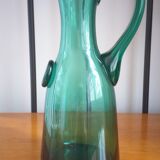 Pitcher made of green glass blown and tinted in the mass