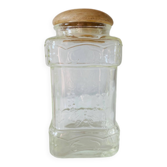 Glass jar with vintage wooden cap