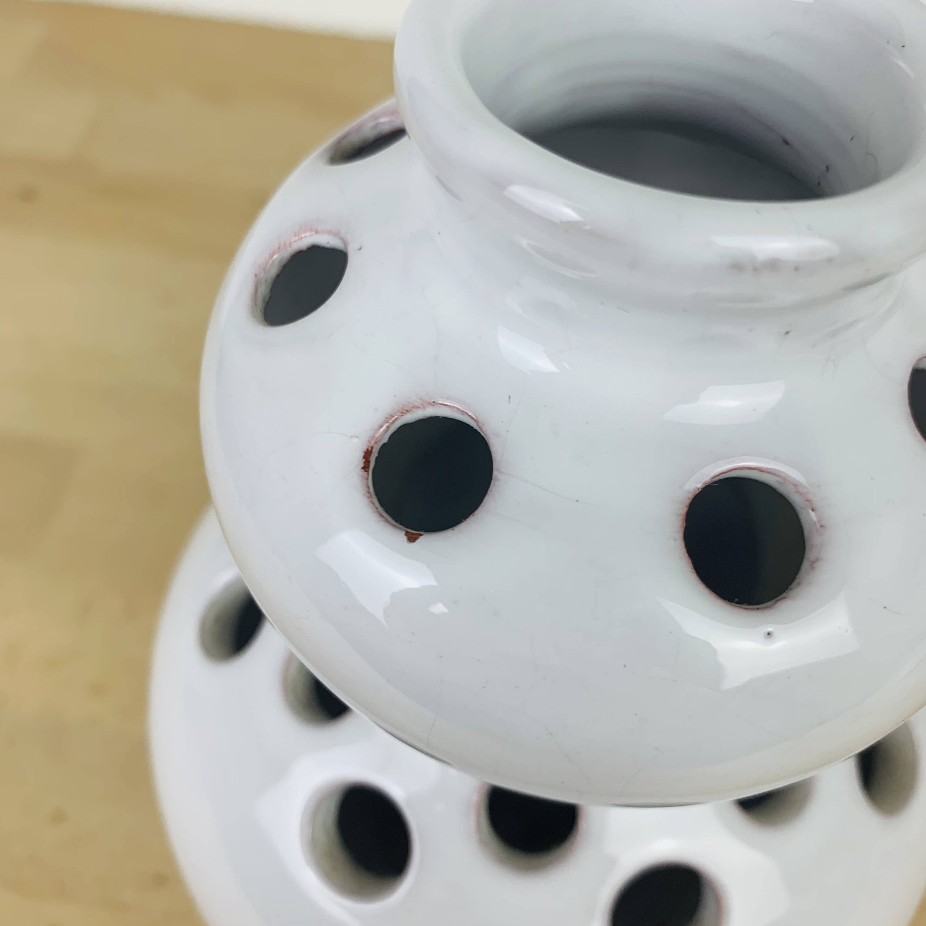 Vase with white ceramic flowers