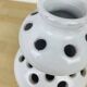 Vase with white ceramic flowers
